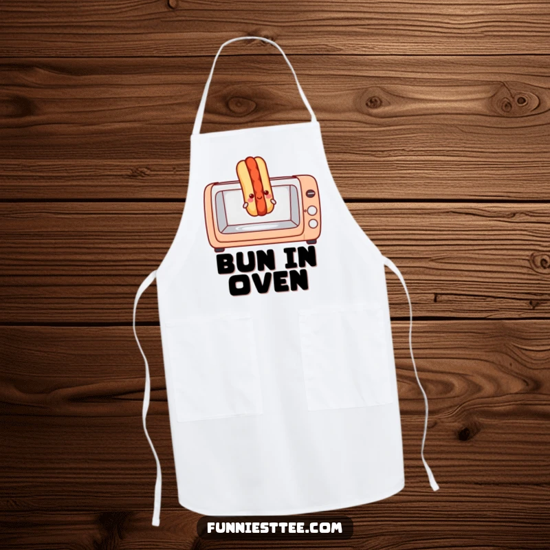 Funny hot dog apron showing a smiling hot dog emerging from a toaster oven, perfect for adding humor to any cooking experience.