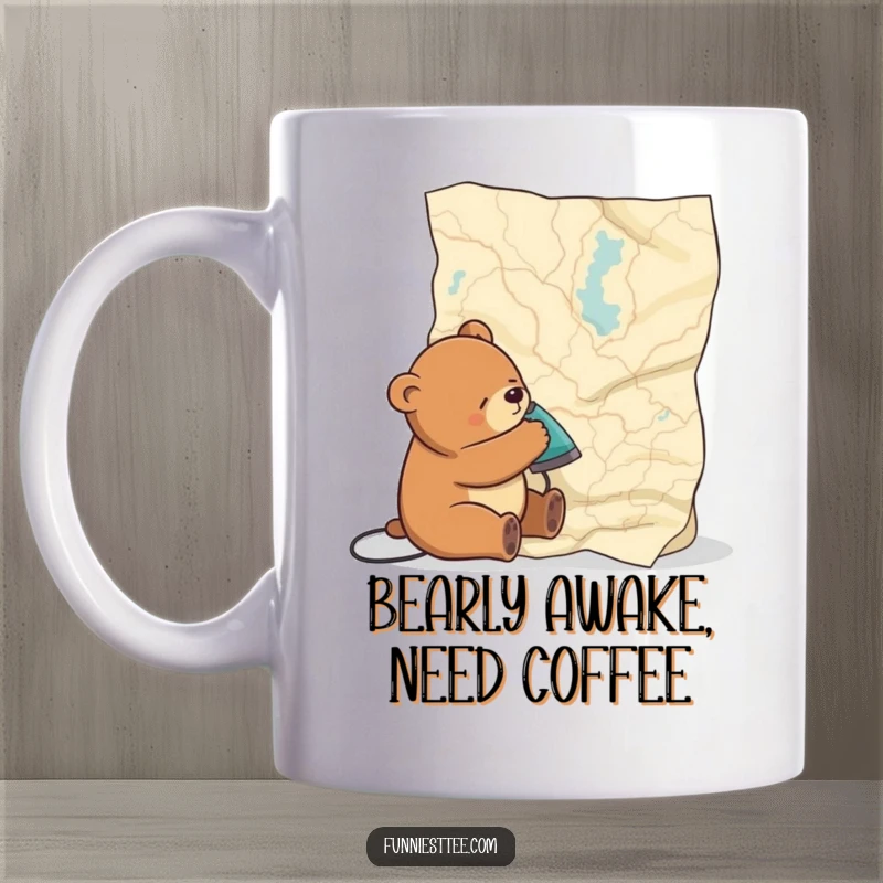 Funny mug with a drowsy bear attempting to smooth out a massive, wrinkled map, capturing a moment of comical exhaustion.
