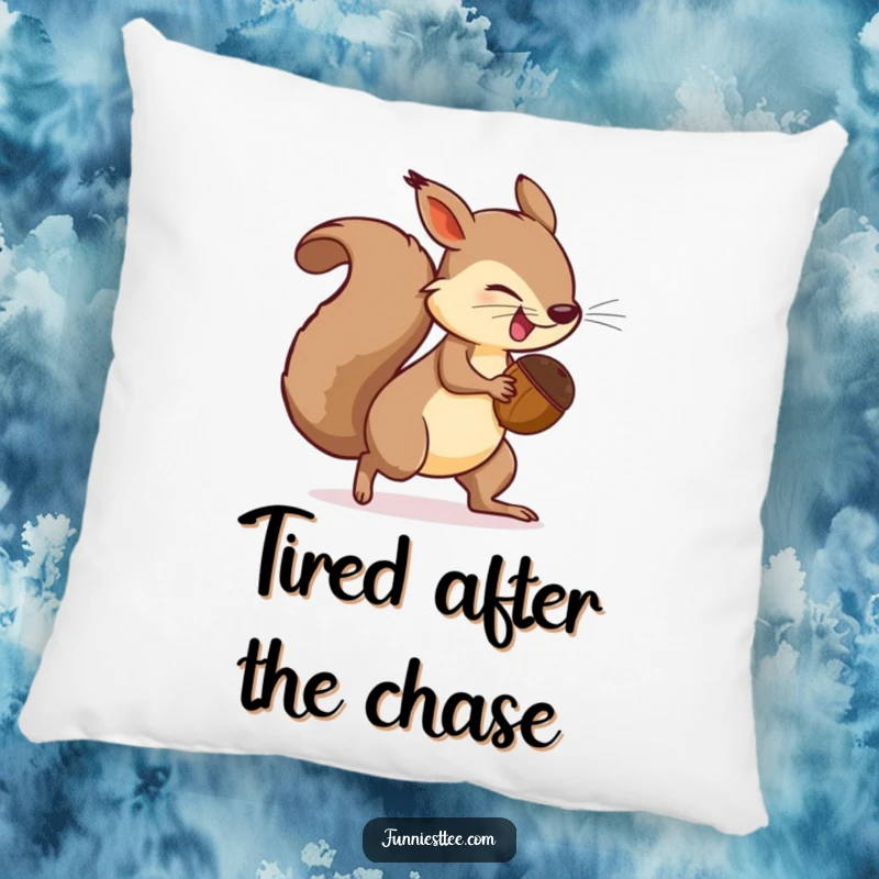 Funny Pillow design: a determined squirrel holding a comically large acorn is spinning in pursuit of its own tail.