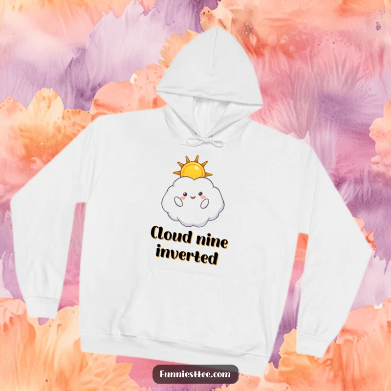 Funny hoodie featuring a fluffy cloud character floating inverted, holding a radiant sun, offering a warm and comical celestial hug.