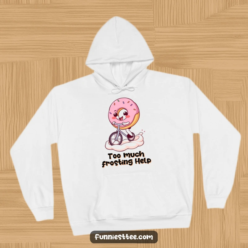 Funny donut hoodie showing a smiling donut character balancing on a unicycle, riding across a swirled frosting background, radiating cheerful energy.