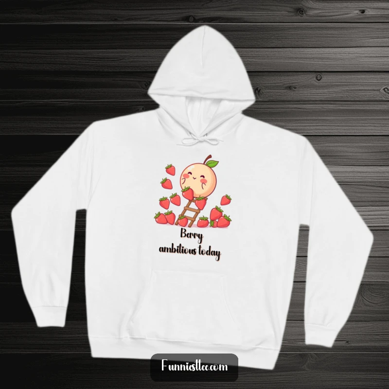 Funny hoodie featuring a blushing peach climbing a ladder made of strawberries, a cozy depiction of sweet striving and ambition.