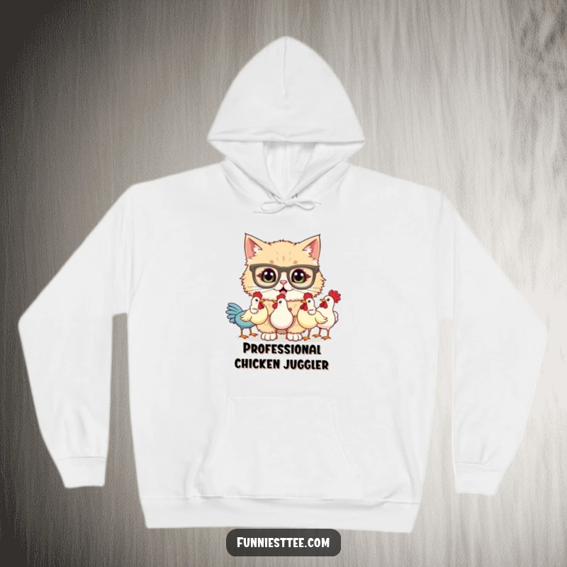 Funny hoodie with a fluffy cat wearing oversized glasses, hilariously attempting to juggle three rubber chickens, looking utterly perplexed by the situation.