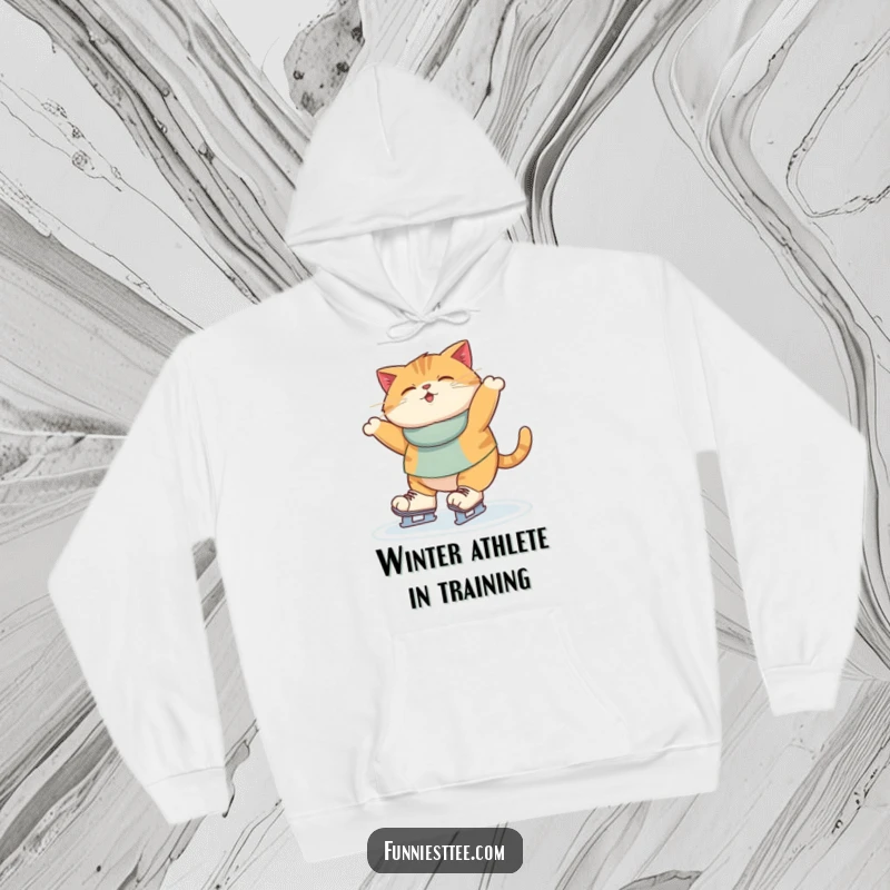 Funny Hoodie print of a round cat wobbling unsteadily on ice skates, its oversized paws slipping, creating a comical scene.