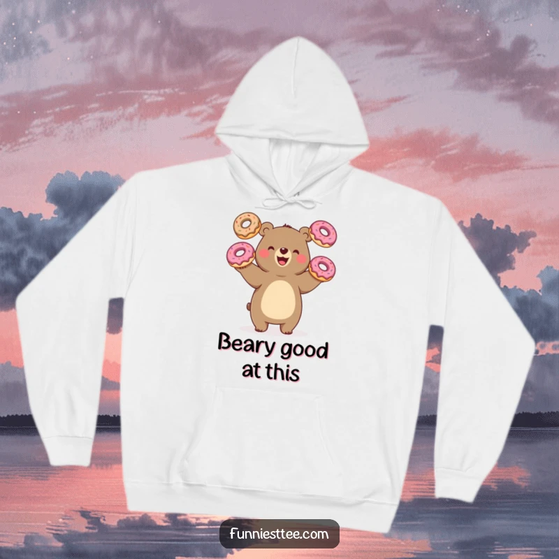Funny bear juggling donuts, oversized treats, cozy hoodie design, radiating happiness and humor, great gift.