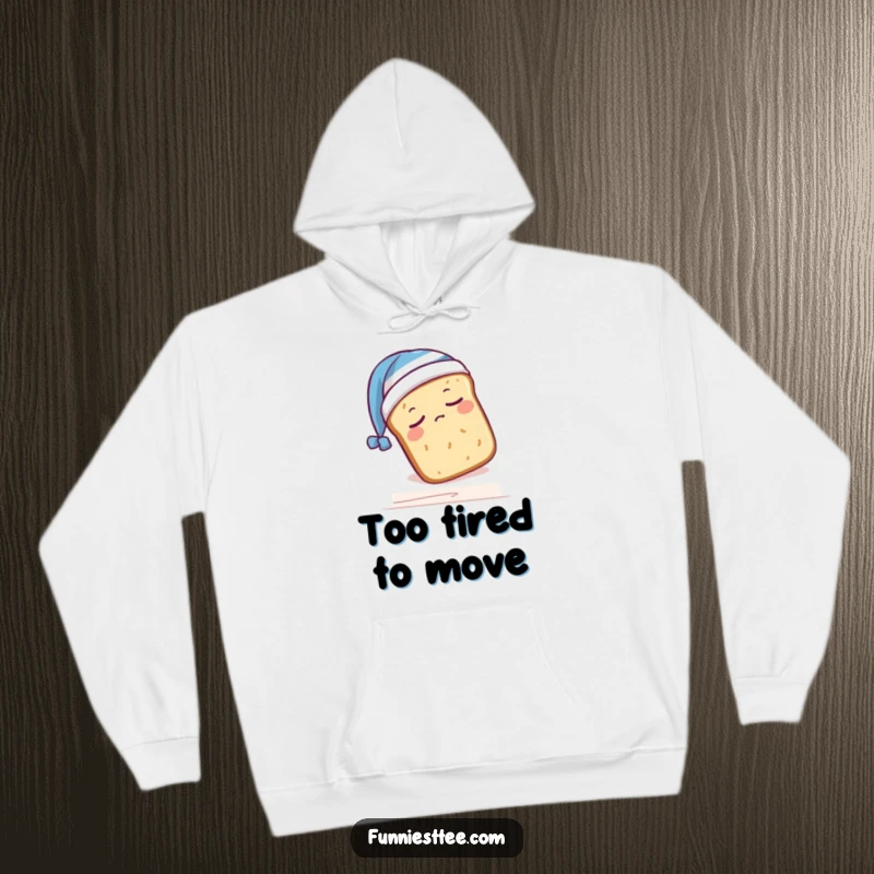Funny hoodie depicting a sleepy bread loaf in a nightcap, humorously falling off a shelf, conveying ultimate comfort and humor.