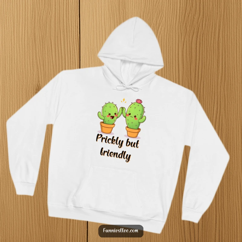 Funny hoodie with two prickly cactus characters cautiously reaching for a high-five, offering warmth and comical friendship vibes.
