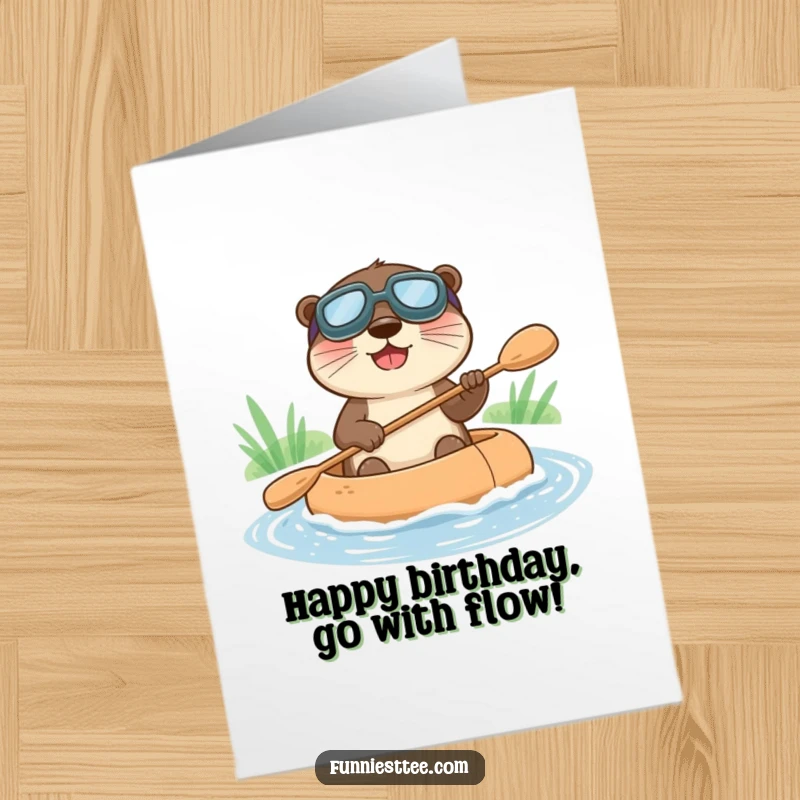 Funny Free Printable Birthday Card: Happy otter in goggles joyfully paddles a miniature raft down a stream, celebrating a birthday.
