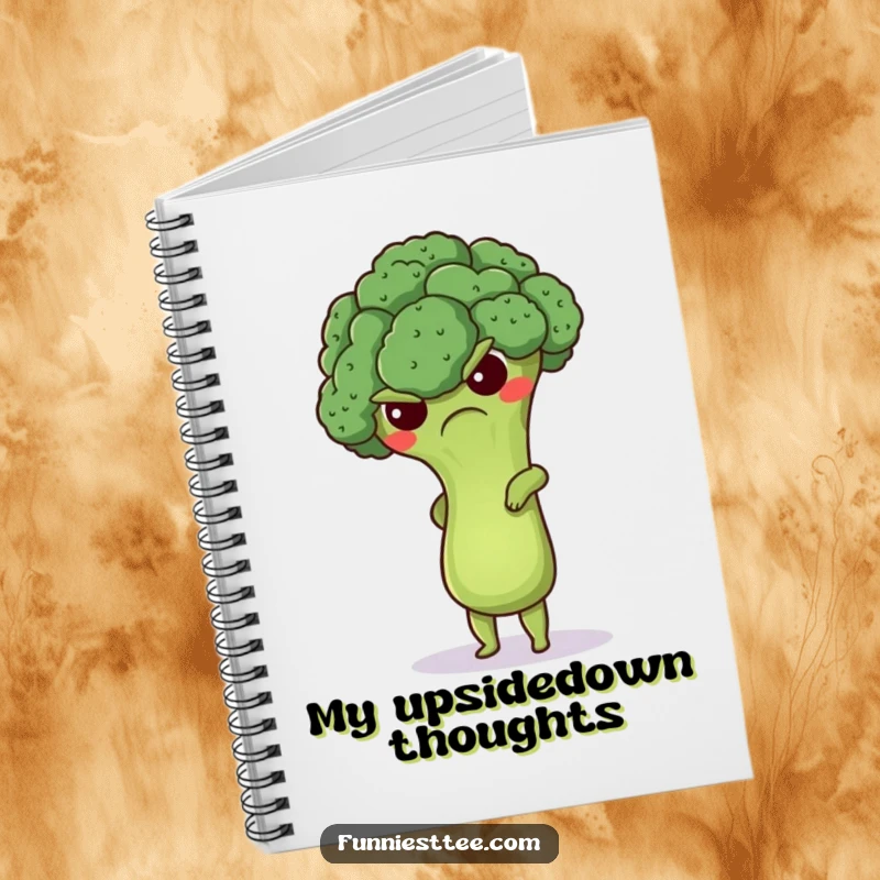 Funny grumpy broccoli notebook featuring a cute floret attempting a handstand, ideal for jotting down notes with a humorous fitness twist.