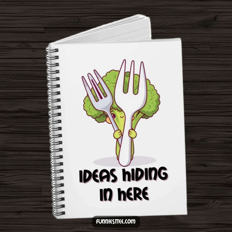 Funny notebook with a shy broccoli character hiding behind a large fork and spoon, ideal for writing and drawing with a humorous touch.