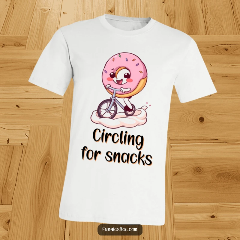 Funny donut t-shirt featuring a smiling donut character expertly riding a tiny unicycle across a vibrant frosting swirl, showcasing determination and fun.