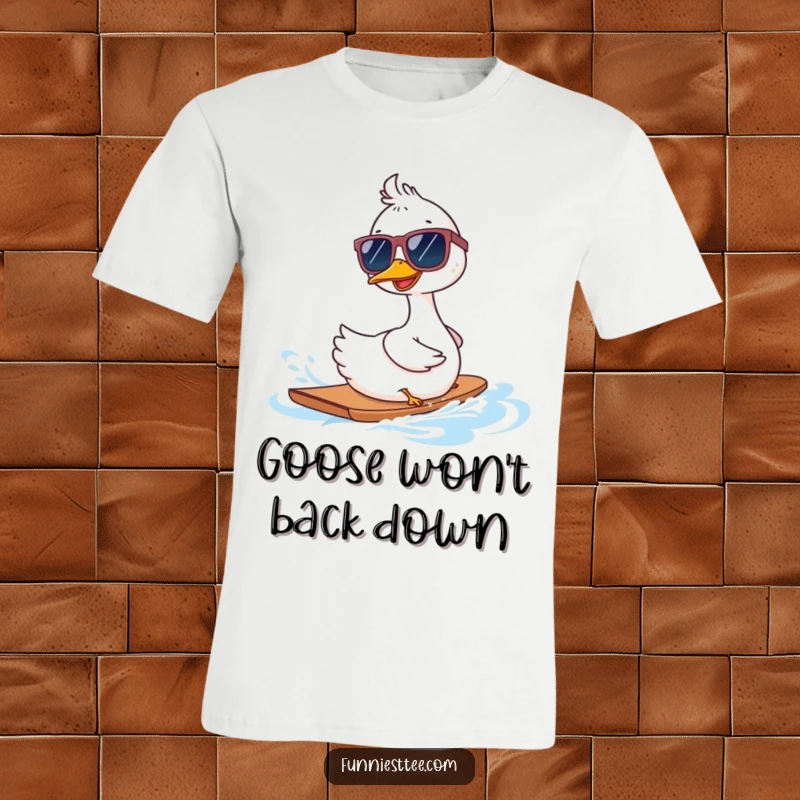 Funny goose in oversized sunglasses waterskiing backwards on a t-shirt, showcasing a bold and comical aquatic adventure.