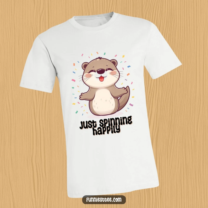 Funny t-shirt featuring a delighted otter with eyes closed, spinning joyfully amidst a shower of confetti, radiating uninhibited happiness.