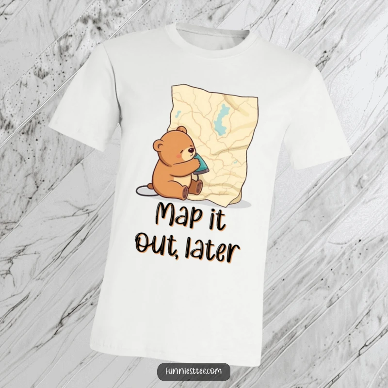 Funny t-shirt depicting a sleepy bear comically trying to iron a huge, crumpled map, showcasing a shared feeling of being overwhelmed.