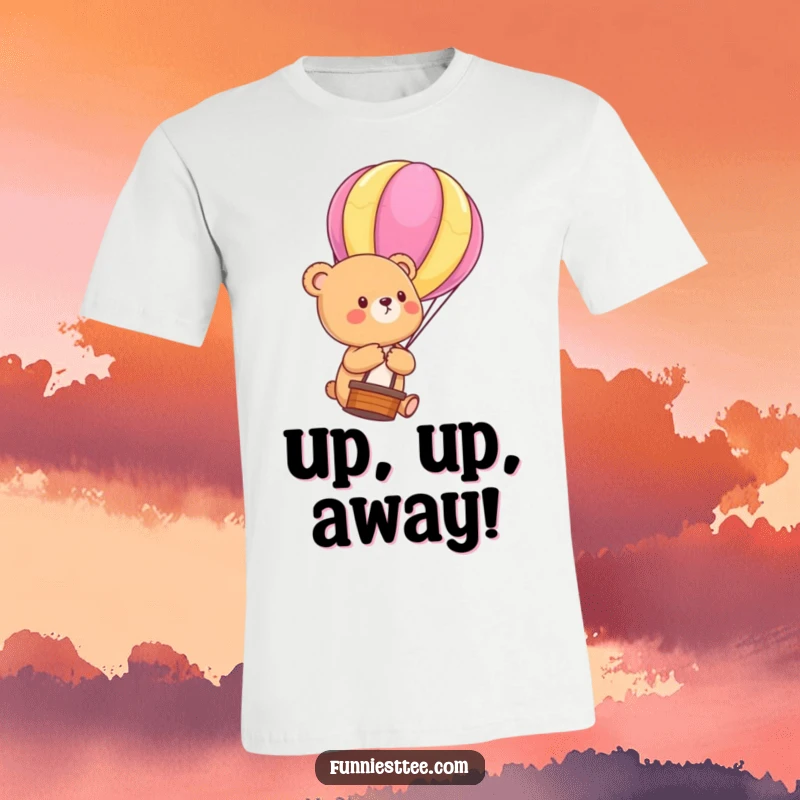 Funny Bear Cub Balloon T-Shirt: Soft tee showing a cute bear cub floating upwards, holding a brightly colored hot air balloon string, a funny dream-chasing design.